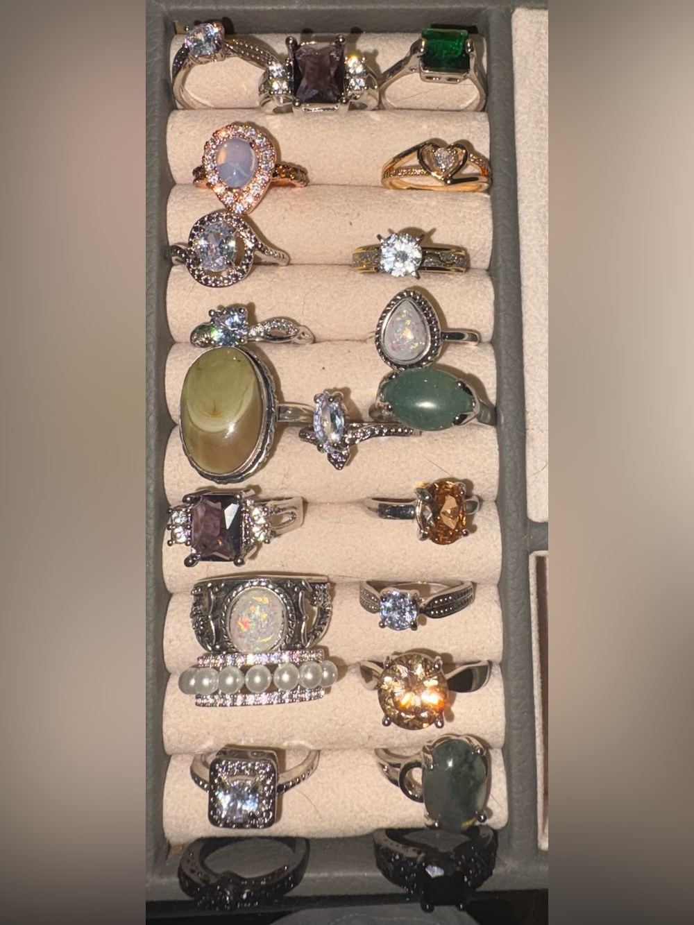 Mixed Gemstone costume rings in various sizes. You get all 22 rings shown.